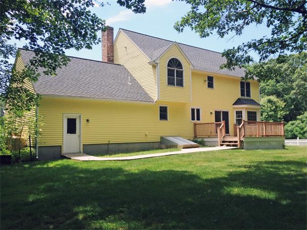 15 McGuire Road Sutton, MA 01590 - Photo 3 of 30 a front view of a house with a yard and garage