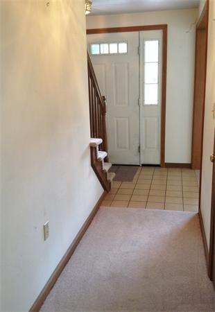 15 McGuire Road Sutton, MA 01590 - Photo 8 of 30 a view of a hallway with wooden floor and a window