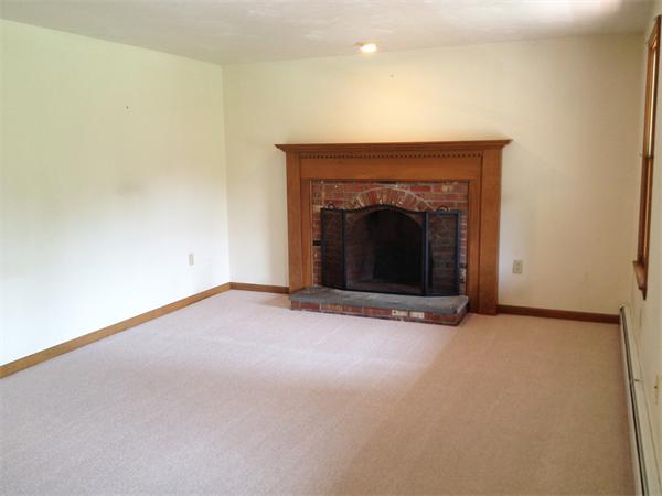 15 McGuire Road Sutton, MA 01590 - Photo 9 of 30 a view of empty room with a fireplace
