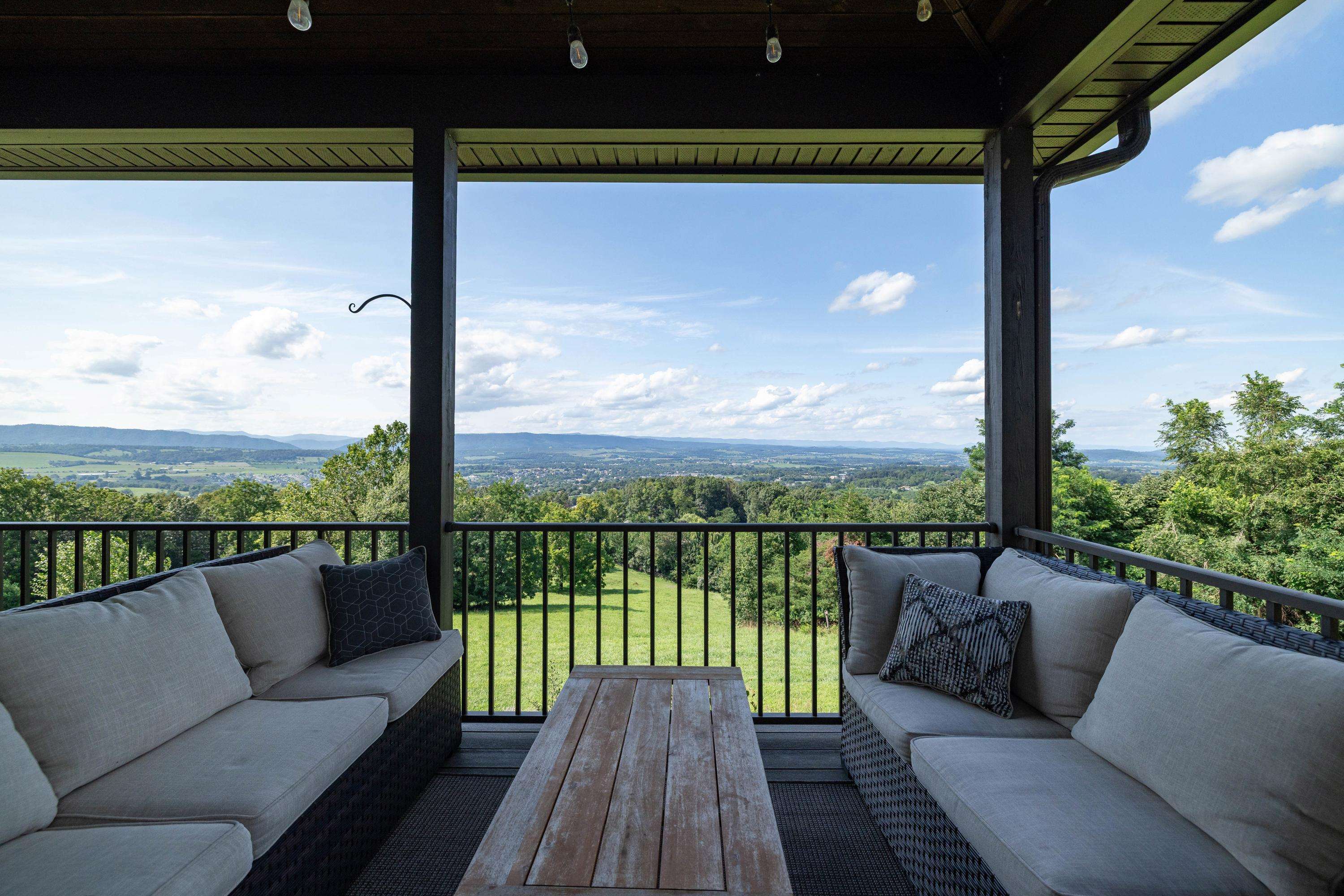 11180 Daphna Road Broadway, VA 22815 - Photo 24 of 75 The spacious front porch allows a covered area for overlooking the beautiful views the home offers. This porch features composite building materials, and is large enough for a table and chairs set.