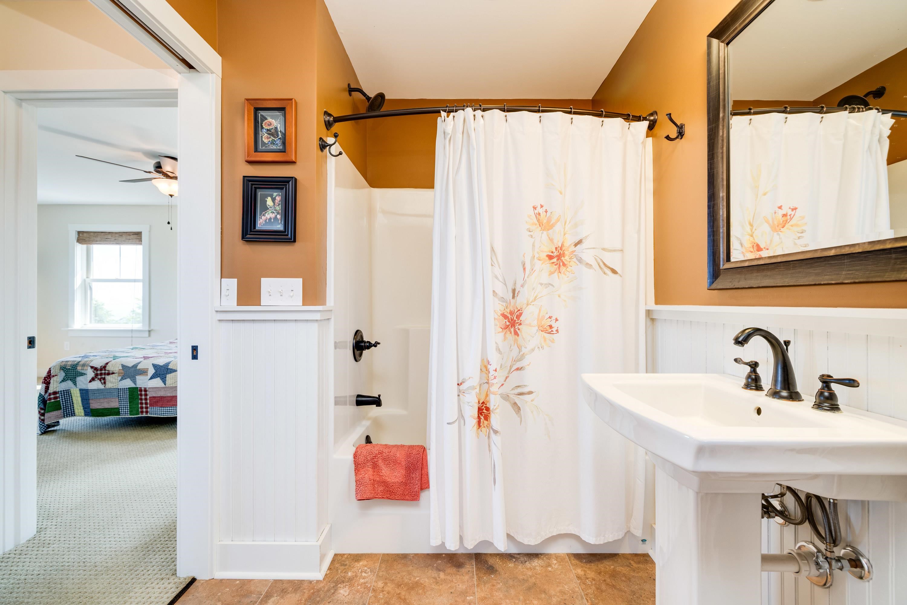 11180 Daphna Road Broadway, VA 22815 - Photo 40 of 75 This full bathroom offers convenience to bedroom 2 and 3. This bathroom features a pedastal sink and features a full bathtub/shower combination.