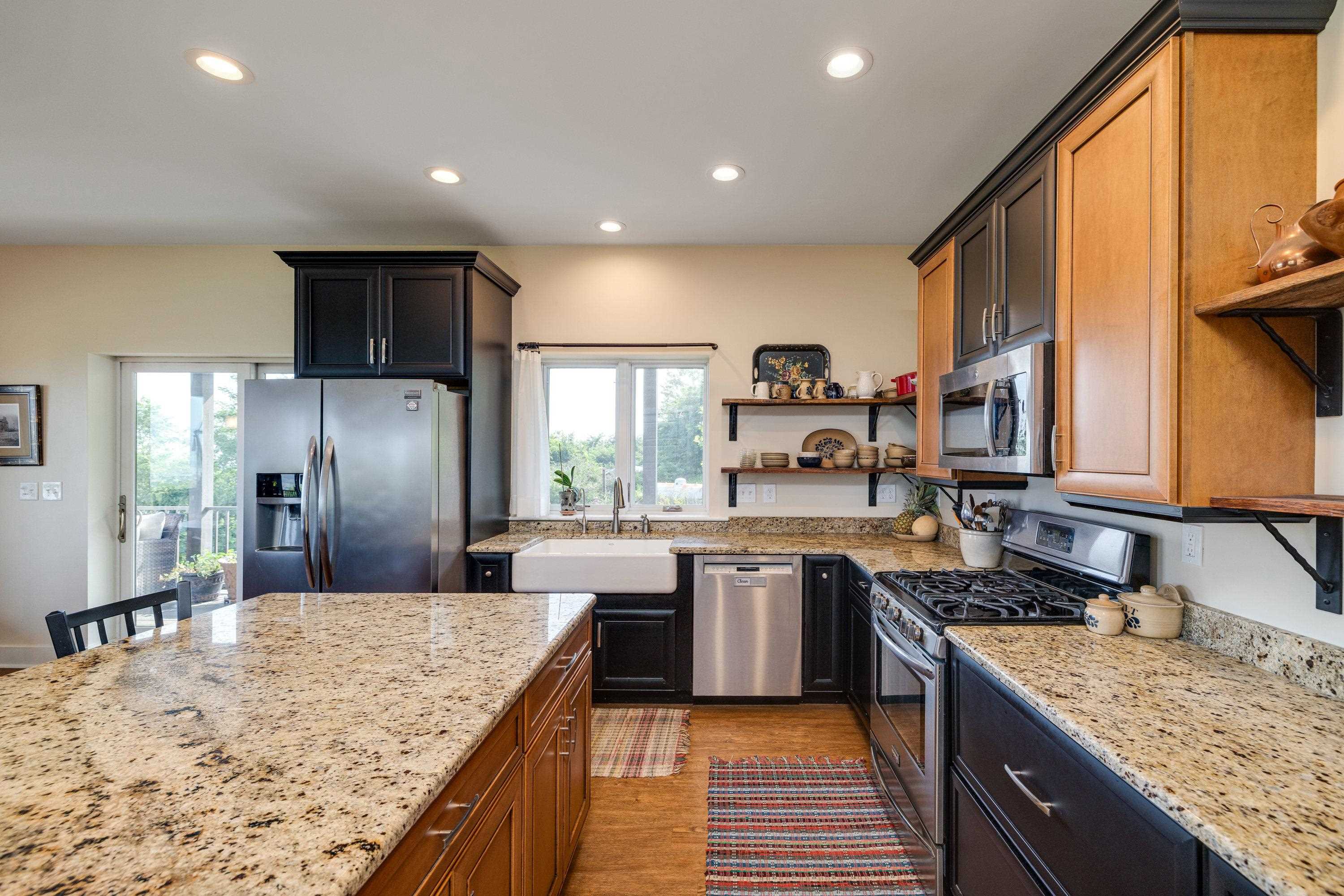 11180 Daphna Road Broadway, VA 22815 - Photo 10 of 75 The kitchen features hardwood flooring throughout the space. Wooden cabinetry, granite counter-tops, recessed lighting, eat-up island area, stainless steel appliances, and much more!