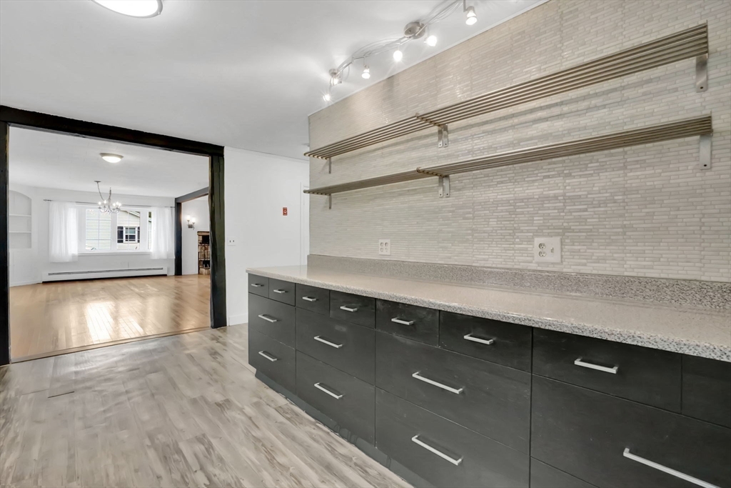 20 Pomeroy Meadow Road Easthampton, MA 01027 - Photo 11 of 42 a view of a center island in a kitchen