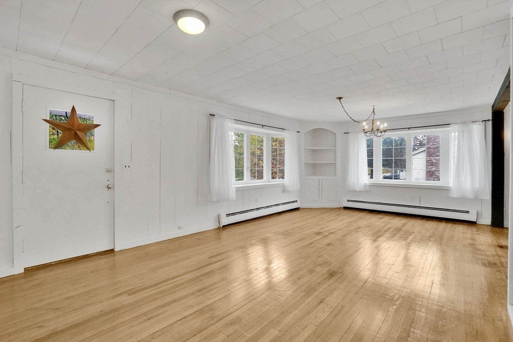 20 Pomeroy Meadow Road Easthampton, MA 01027 - Photo 19 of 42 an empty room with wooden floor and windows