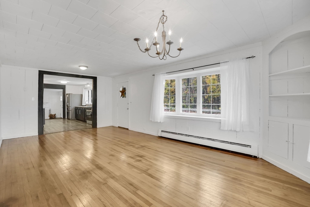 20 Pomeroy Meadow Road Easthampton, MA 01027 - Photo 22 of 42 a view of an empty room with a window and wooden floor