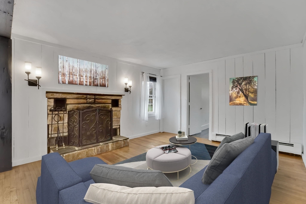 20 Pomeroy Meadow Road Easthampton, MA 01027 - Photo 23 of 42 a living room with furniture and a fireplace