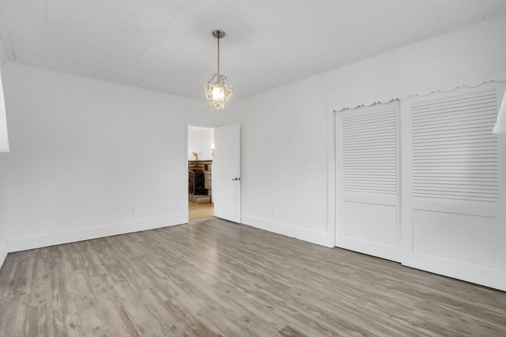 20 Pomeroy Meadow Road Easthampton, MA 01027 - Photo 25 of 42 a view of an empty room with wooden floor and entryway
