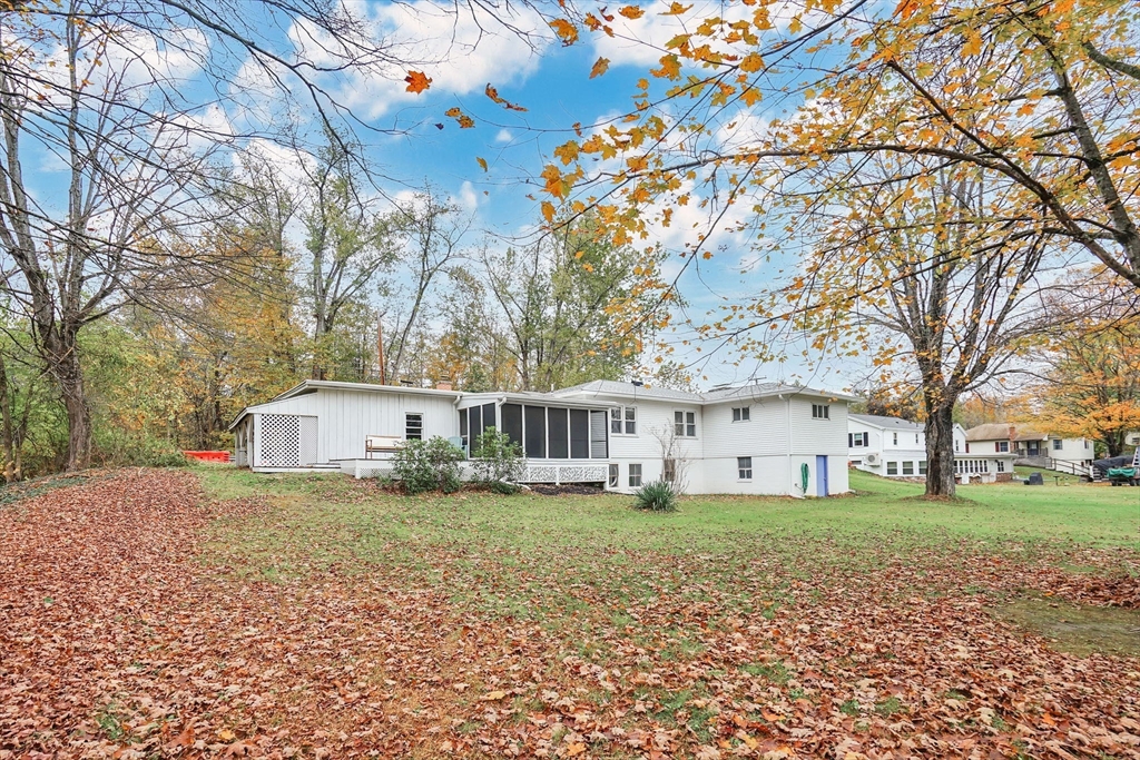 20 Pomeroy Meadow Road Easthampton, MA 01027 - Photo 3 of 42 a house view with a sitting space and garden