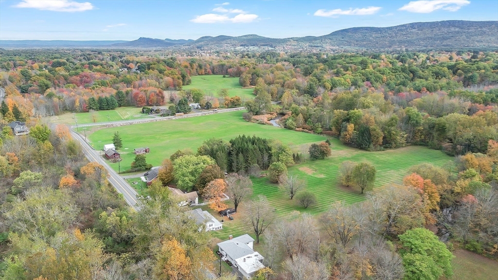 20 Pomeroy Meadow Road Easthampton, MA 01027 - Photo 38 of 42 a view of a lush green hillside and houses