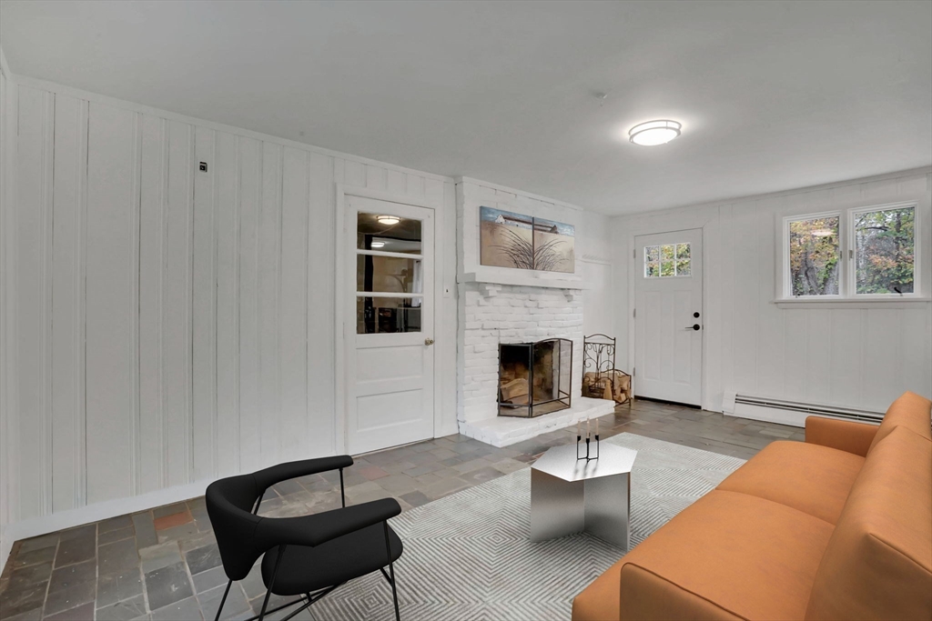 20 Pomeroy Meadow Road Easthampton, MA 01027 - Photo 7 of 42 a living room with furniture and a fireplace