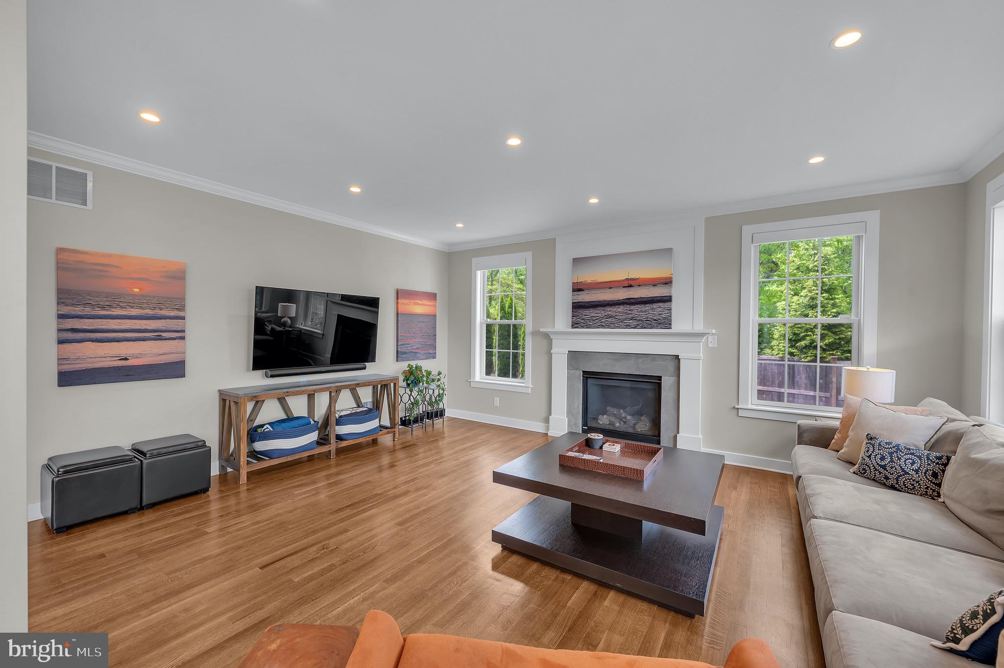 421 Howard Road Gladwyne, PA 19035 - Photo 16 of 49 a living room with furniture a flat screen tv and a fireplace