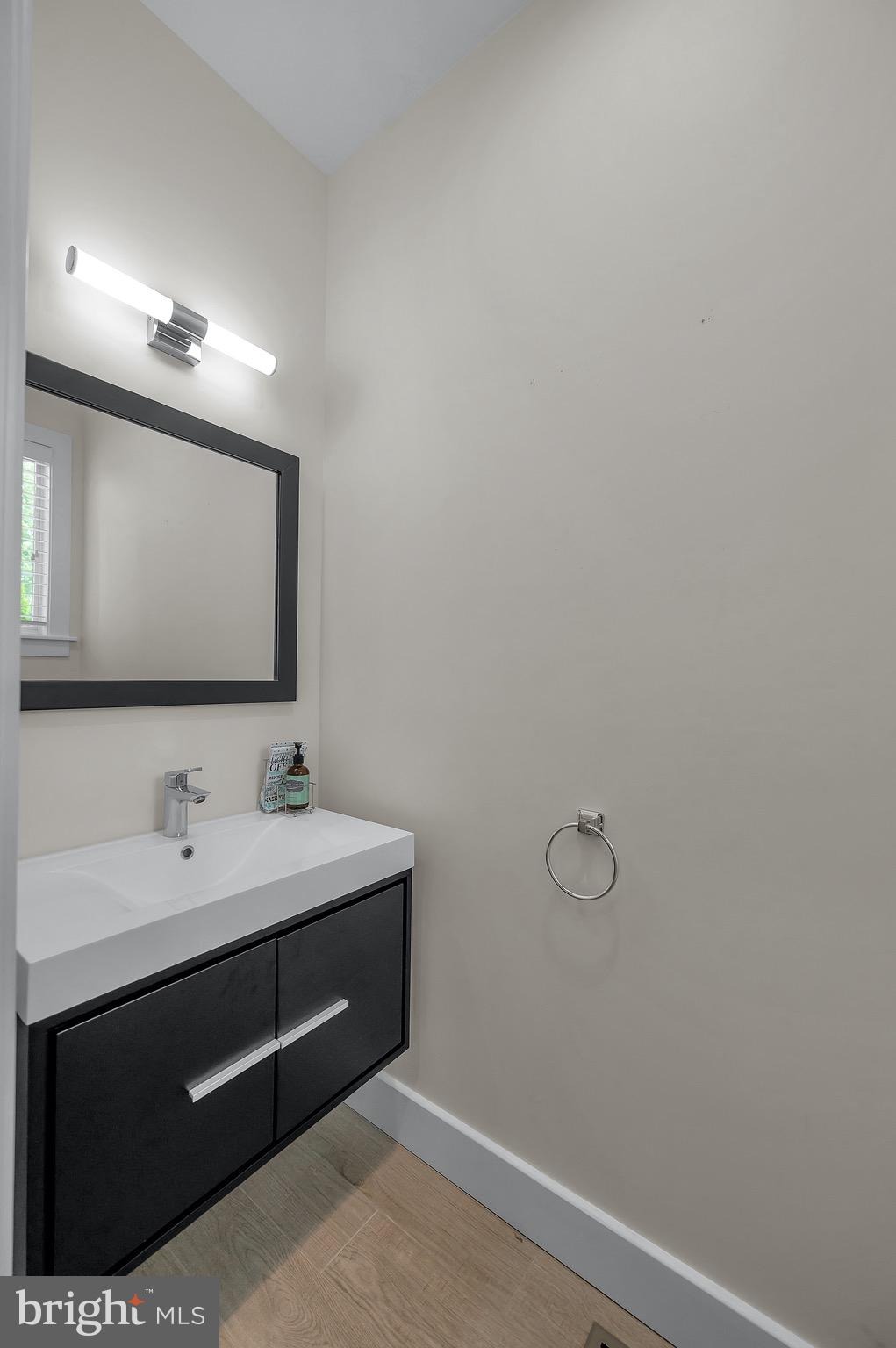 421 Howard Road Gladwyne, PA 19035 - Photo 24 of 49 a bathroom with a toilet sink and mirror