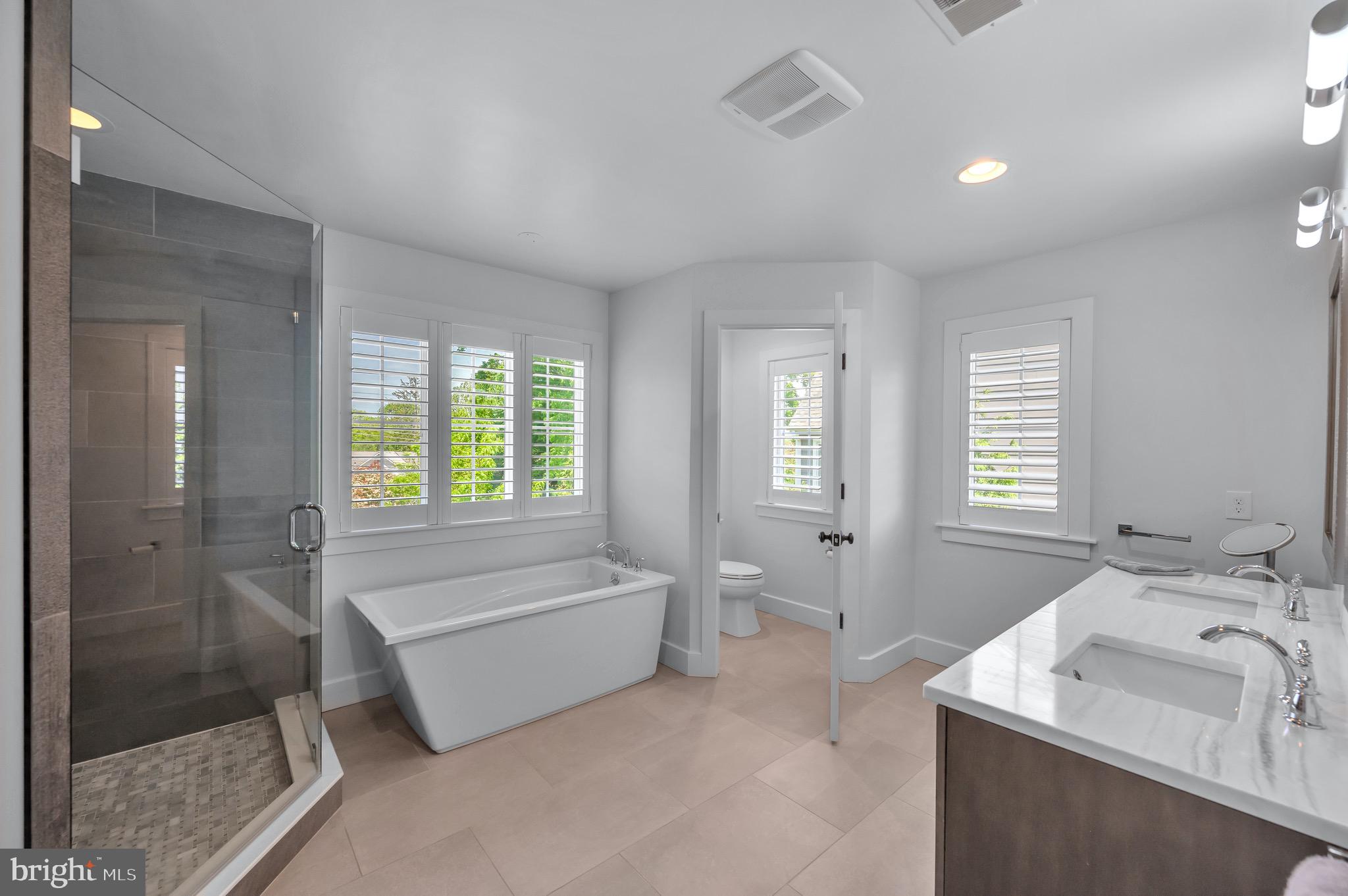 421 Howard Road Gladwyne, PA 19035 - Photo 26 of 49 a spacious bathroom with sink shower and bathtub