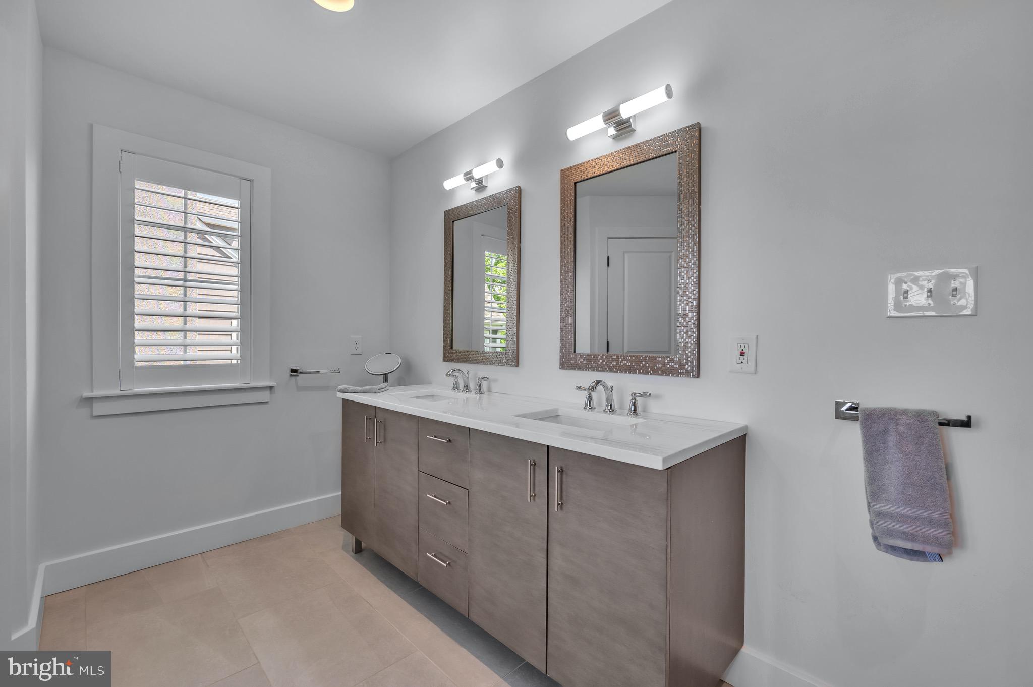 421 Howard Road Gladwyne, PA 19035 - Photo 27 of 49 a bathroom with a sink and a mirror