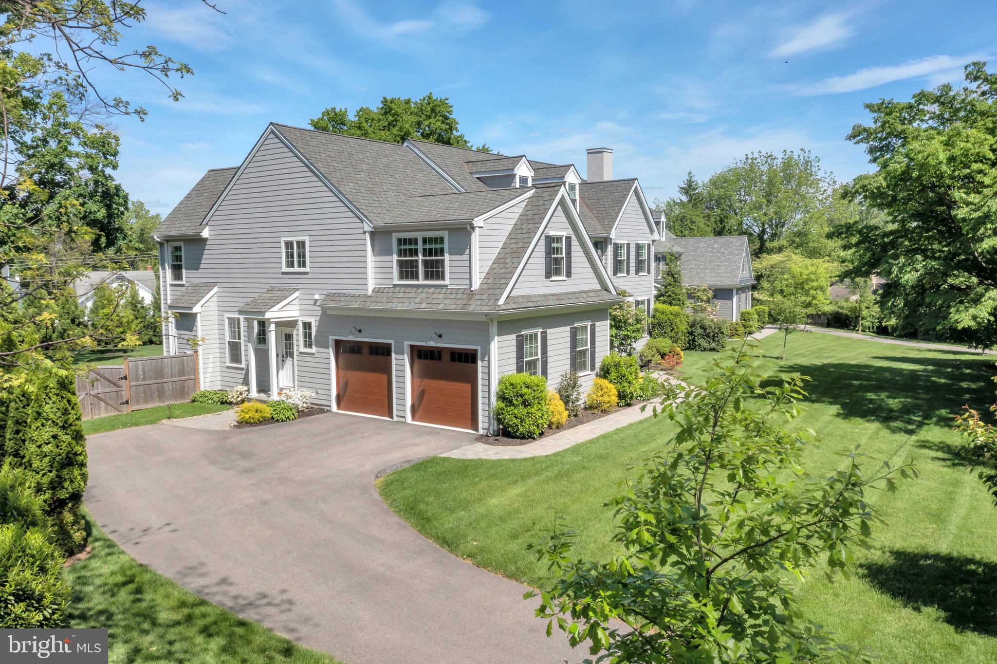 421 Howard Road Gladwyne, PA 19035 - Photo 3 of 49 a view of a house with a yard and potted plants