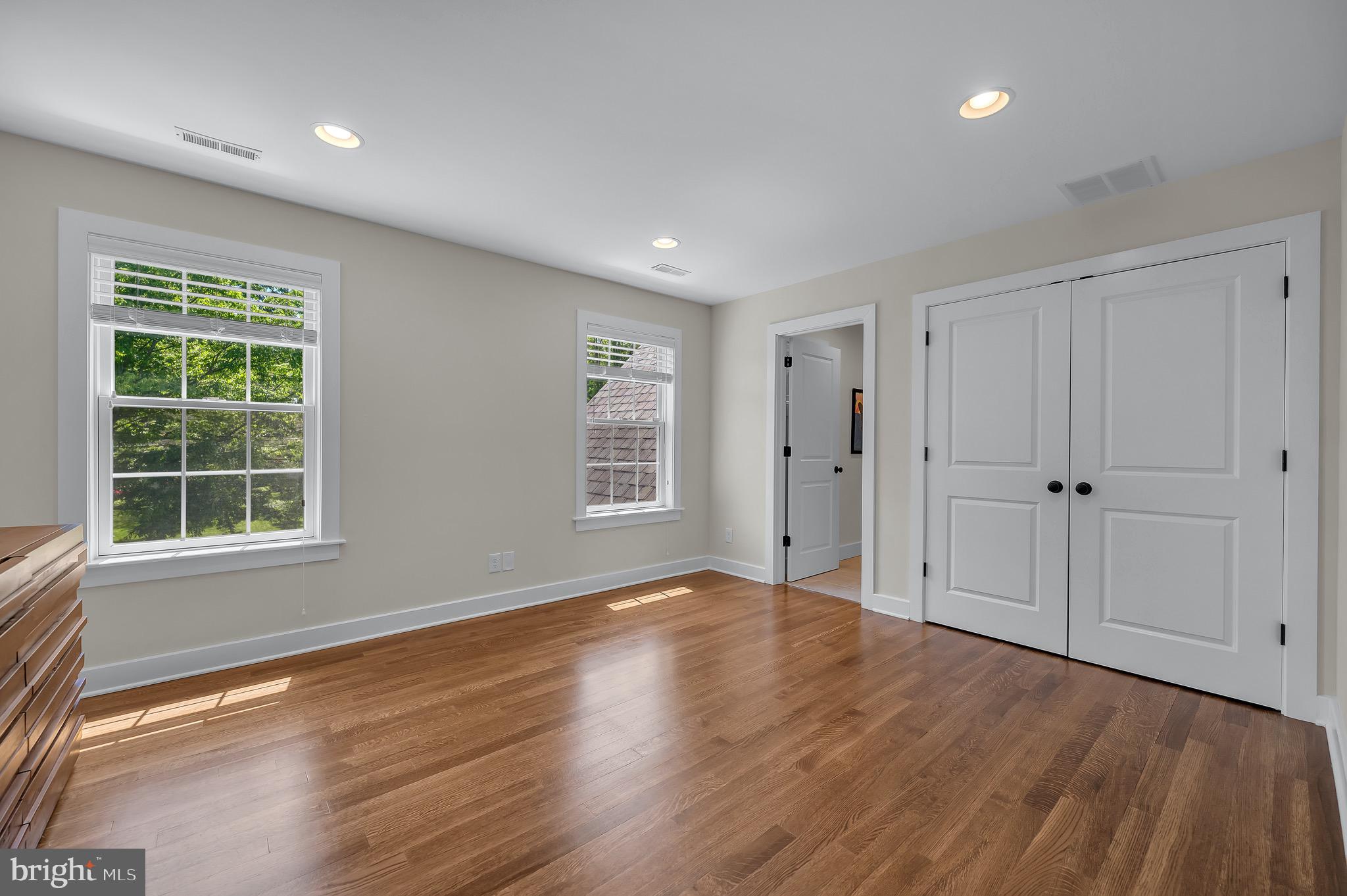 421 Howard Road Gladwyne, PA 19035 - Photo 31 of 49 a view of an empty room with wooden floor and a window