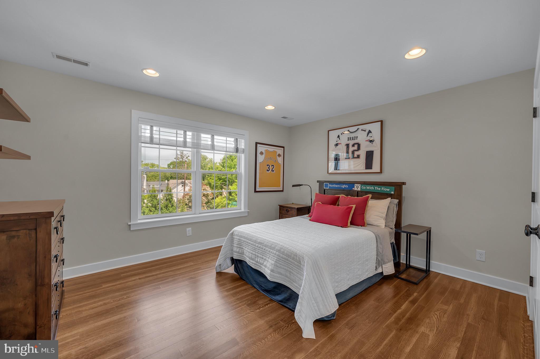 421 Howard Road Gladwyne, PA 19035 - Photo 38 of 49 a bedroom with a bed and a large window