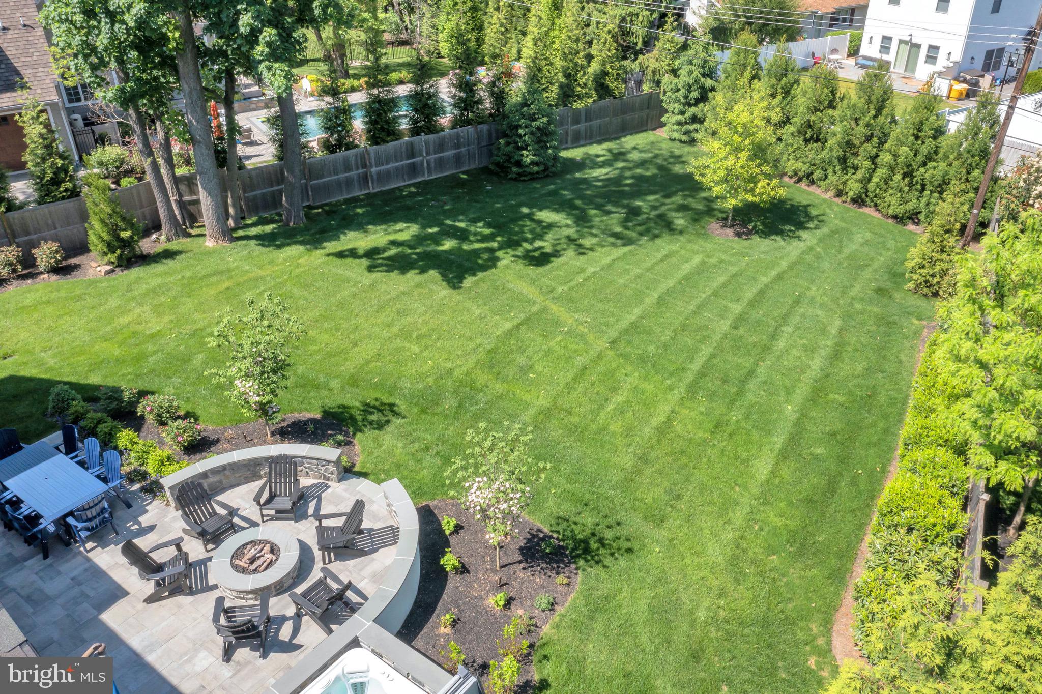 421 Howard Road Gladwyne, PA 19035 - Photo 4 of 49 a view of backyard with table and chairs and potted plants