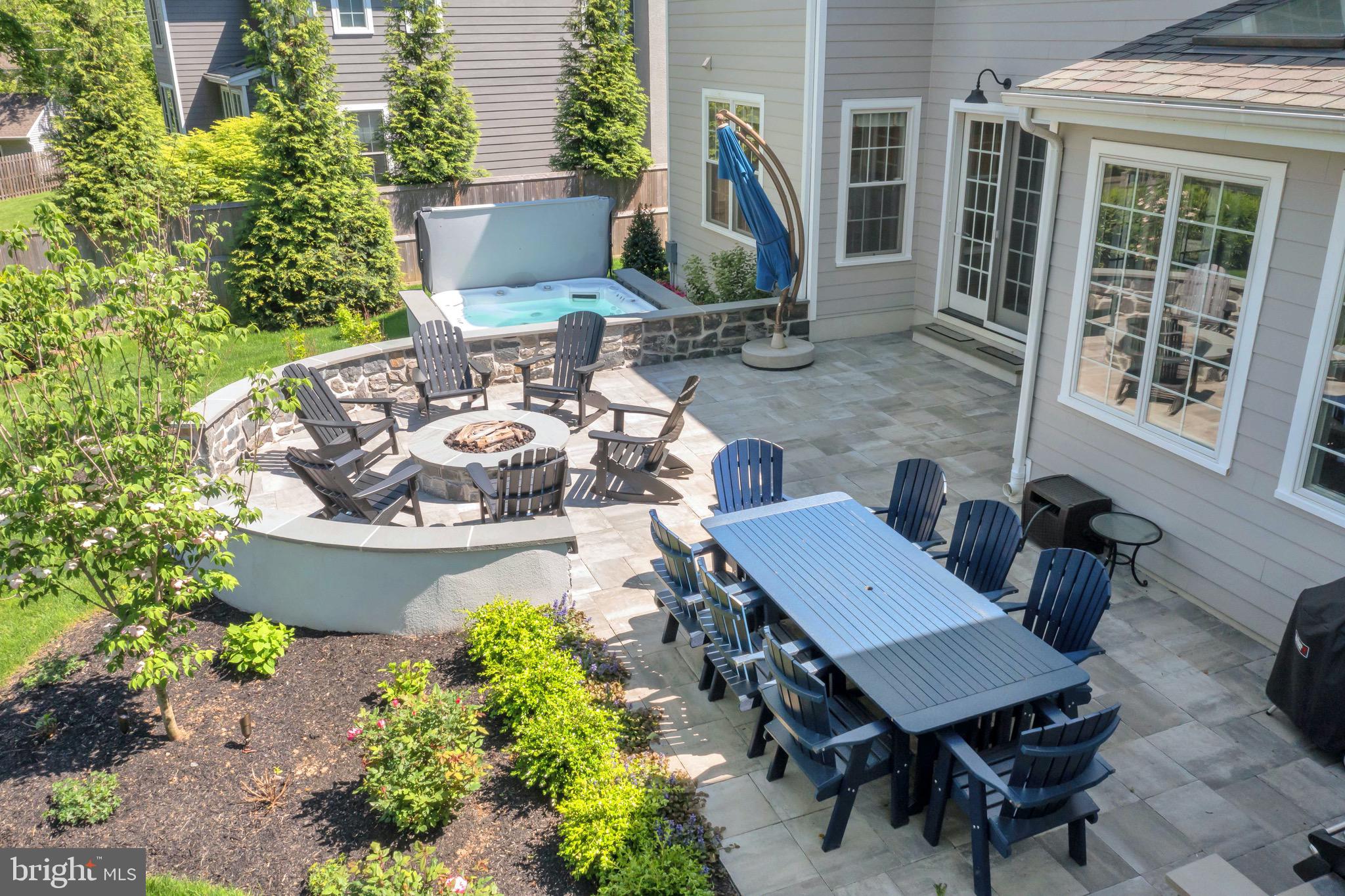 421 Howard Road Gladwyne, PA 19035 - Photo 47 of 49 a view of a patio with table and chairs and potted plants