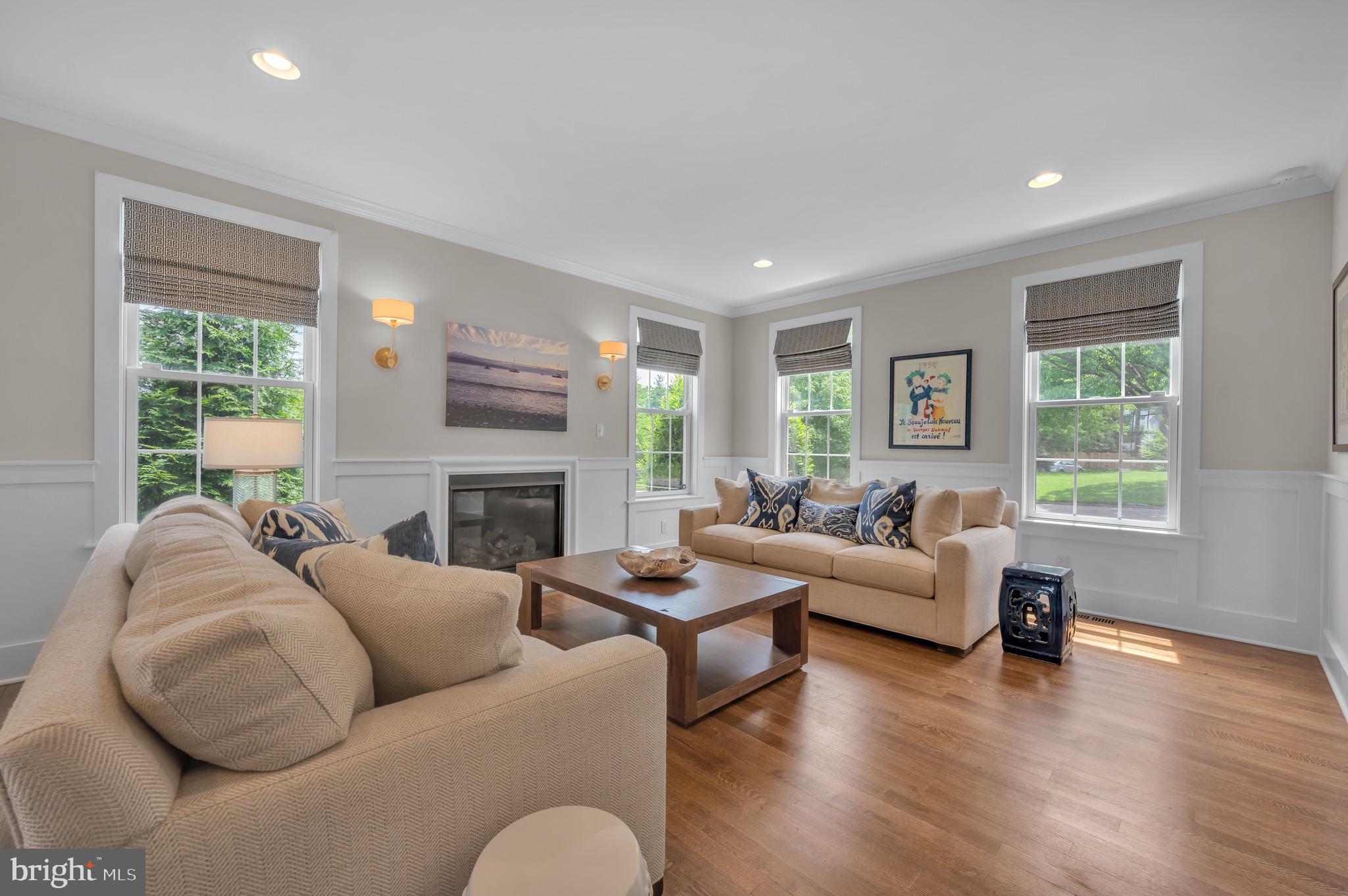 421 Howard Road Gladwyne, PA 19035 - Photo 9 of 49 a living room with furniture fireplace and a large window
