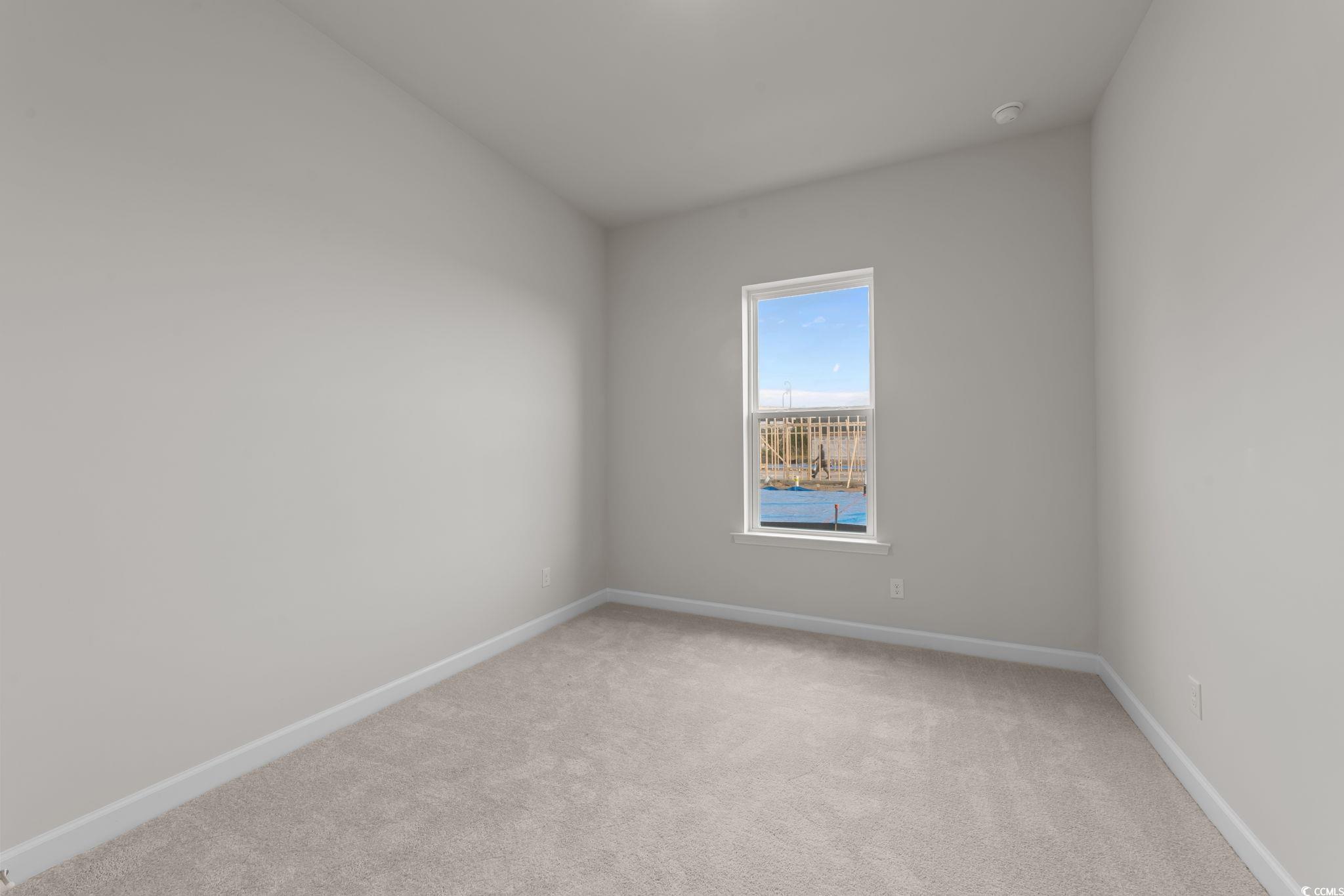 787 Ebb Tide Road Little River, SC 29566 - Photo 17 of 32 Unfurnished room with light carpet and baseboards