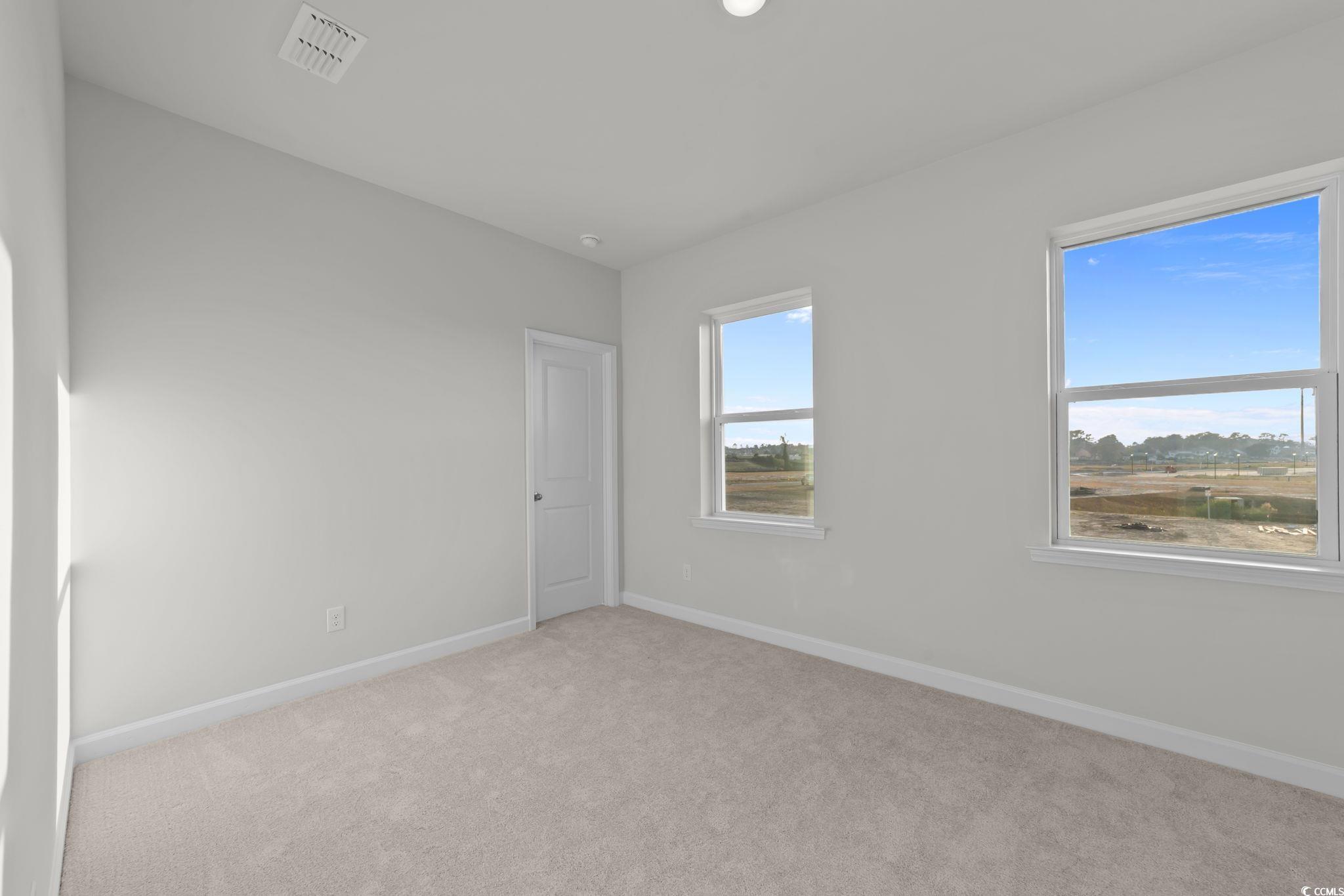 787 Ebb Tide Road Little River, SC 29566 - Photo 20 of 32 Carpeted spare room with baseboards