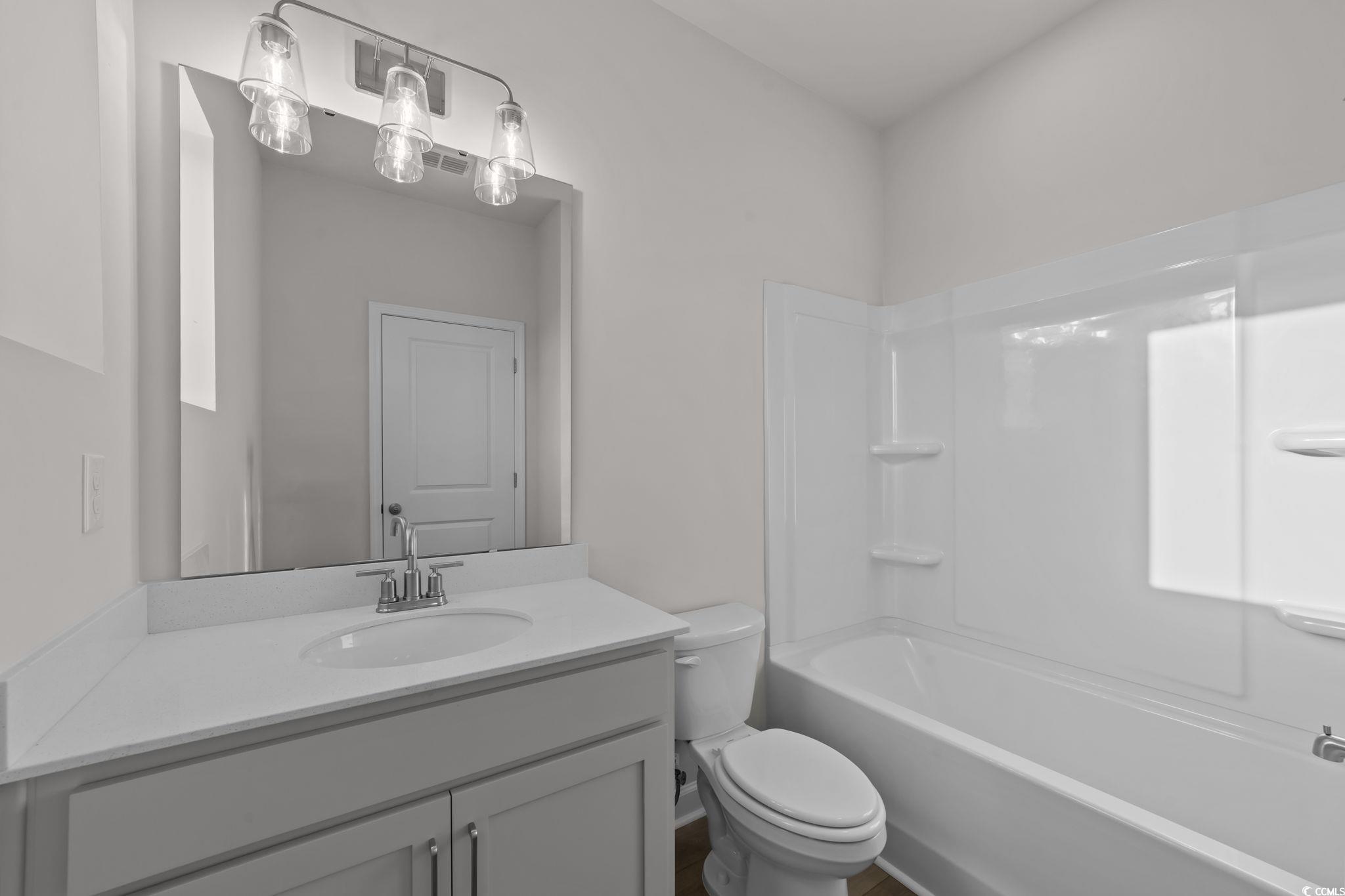 787 Ebb Tide Road Little River, SC 29566 - Photo 21 of 32 Bathroom with bathtub / shower combination and vanity