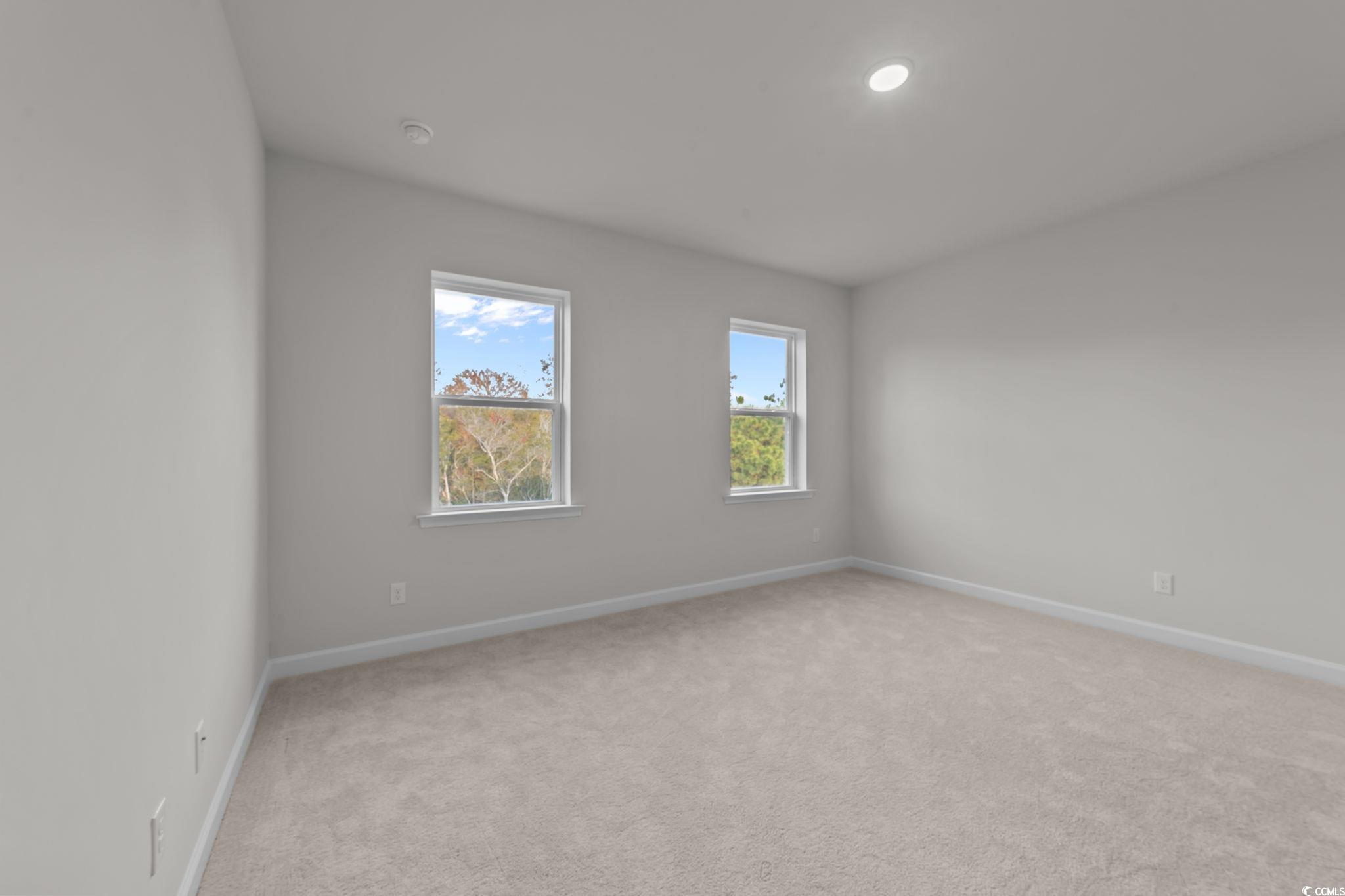787 Ebb Tide Road Little River, SC 29566 - Photo 23 of 32 Spare room with light carpet and recessed lighting