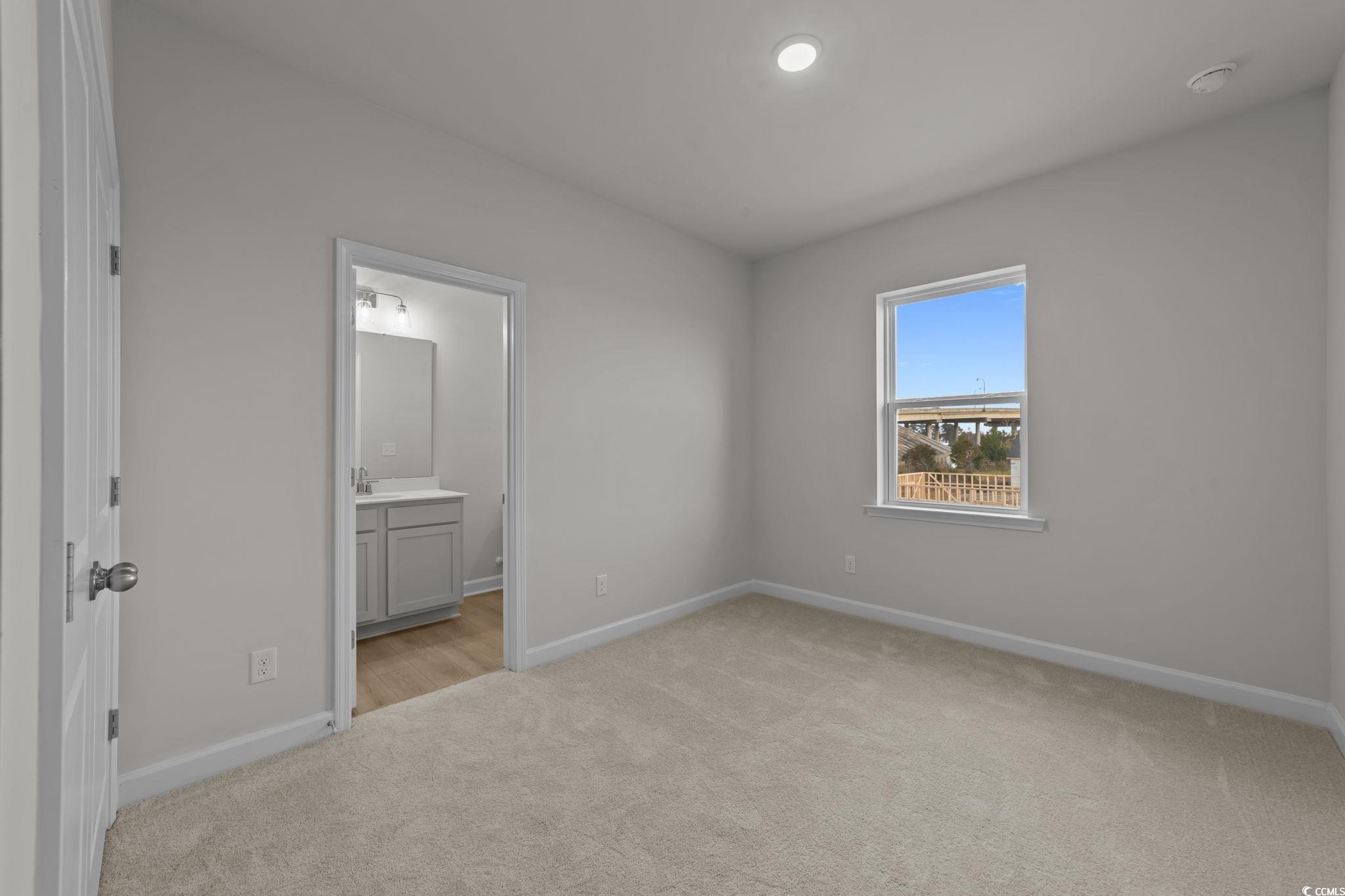 787 Ebb Tide Road Little River, SC 29566 - Photo 25 of 32 Unfurnished room featuring light colored carpet and baseboards