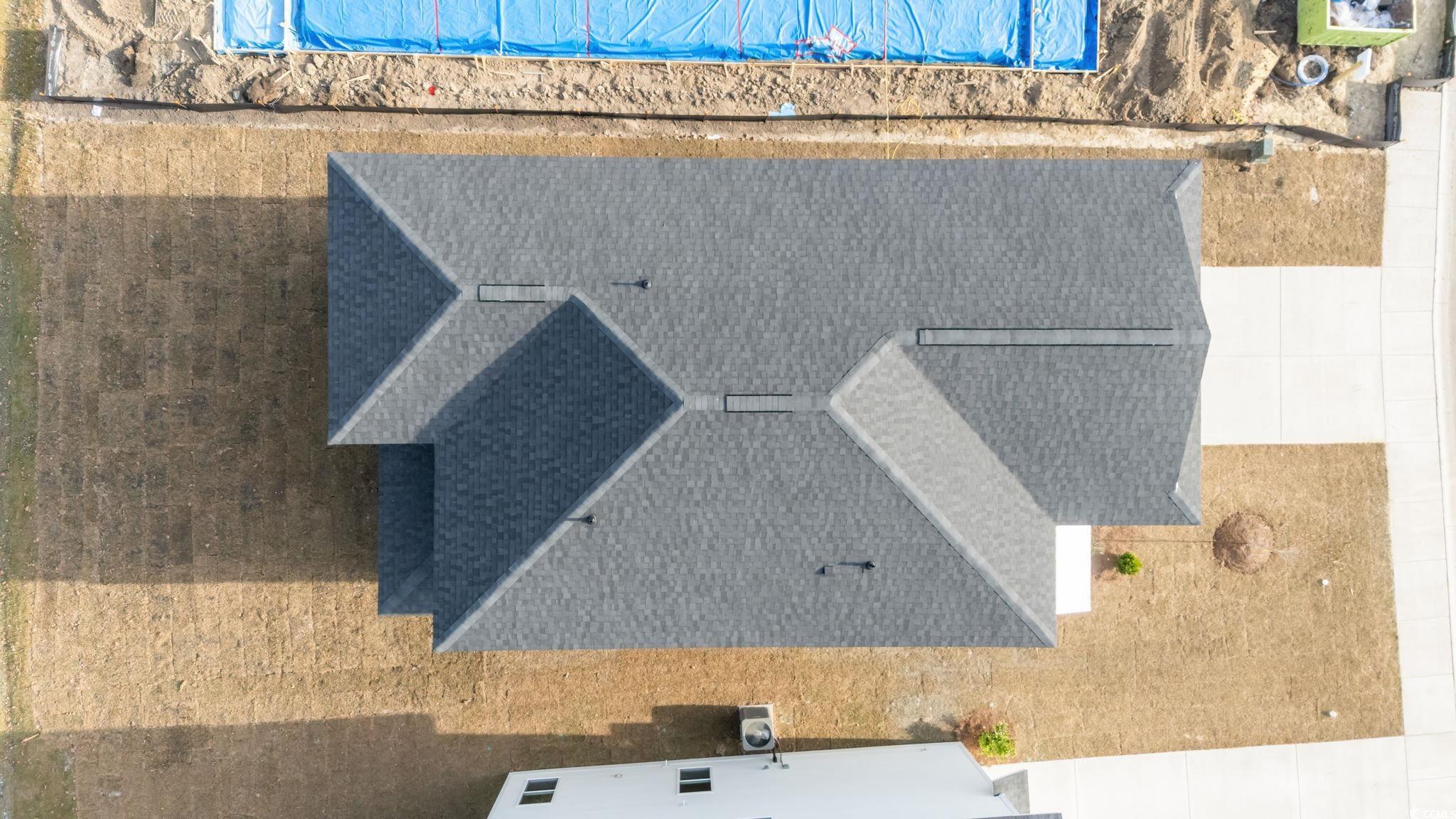 787 Ebb Tide Road Little River, SC 29566 - Photo 32 of 32 View of side of home featuring roof with shingles