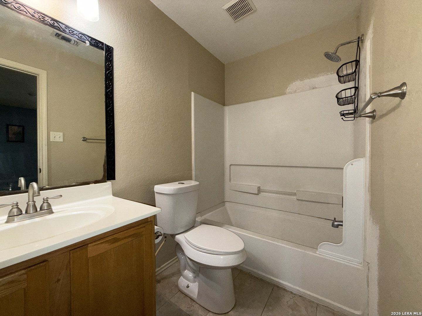 8162 Heights Valley Converse, TX 78109 - Photo 15 of 18 a bathroom with a sink a toilet and shower