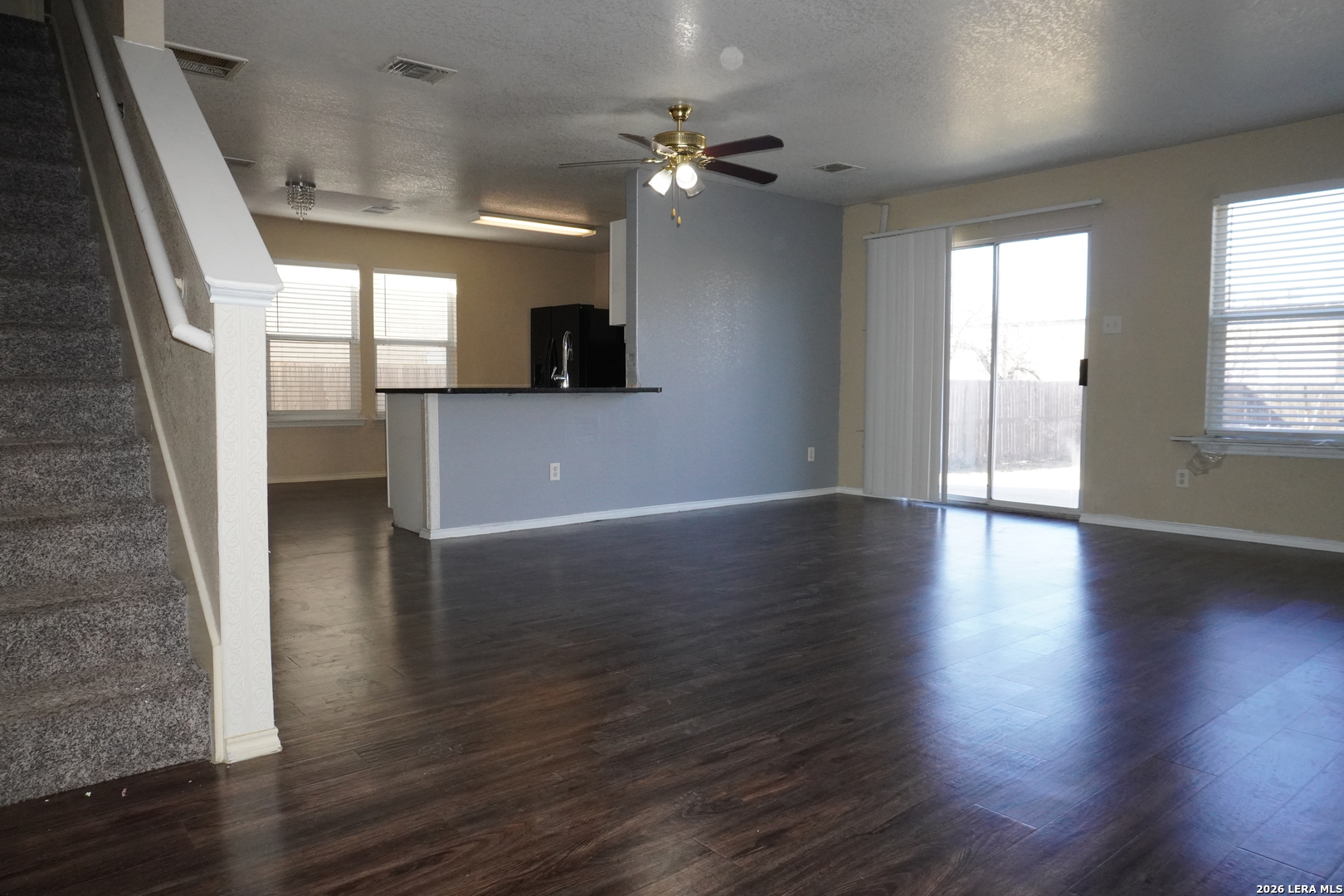8162 Heights Valley Converse, TX 78109 - Photo 5 of 18 an empty room with wooden floor and windows