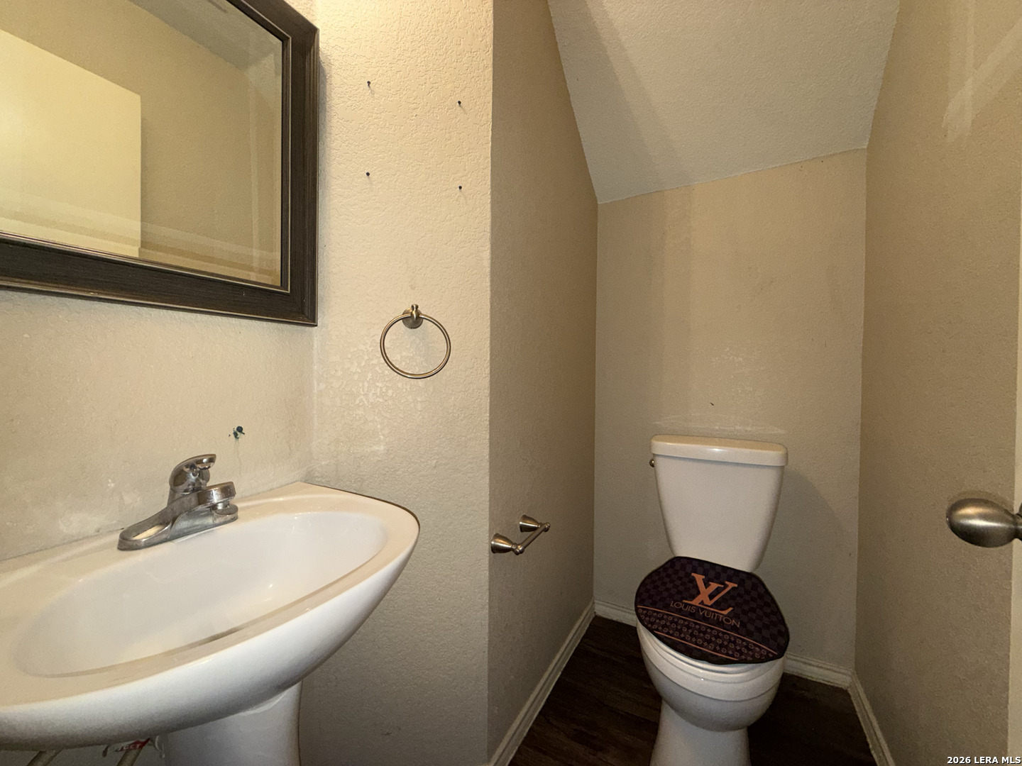 8162 Heights Valley Converse, TX 78109 - Photo 9 of 18 a bathroom with a sink and a toilet