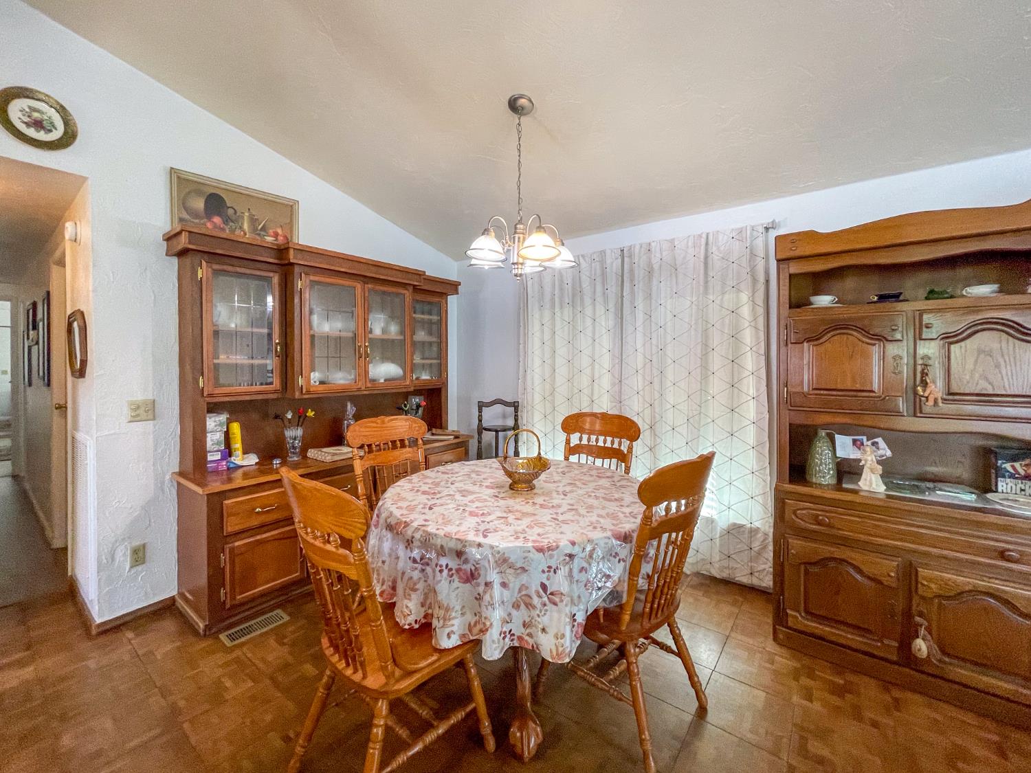 414 F Street Isleton, CA 95641 - Photo 26 of 49 a dining room with furniture a chandelier and window