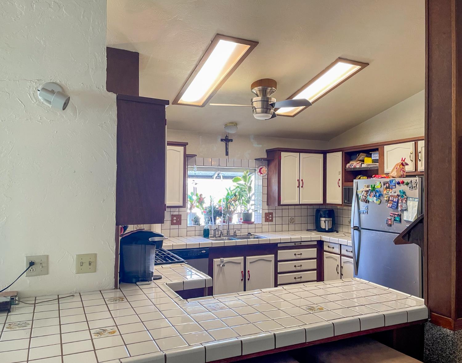 414 F Street Isleton, CA 95641 - Photo 31 of 49 a kitchen with stainless steel appliances kitchen island granite countertop a refrigerator a stove and a wooden cabinets