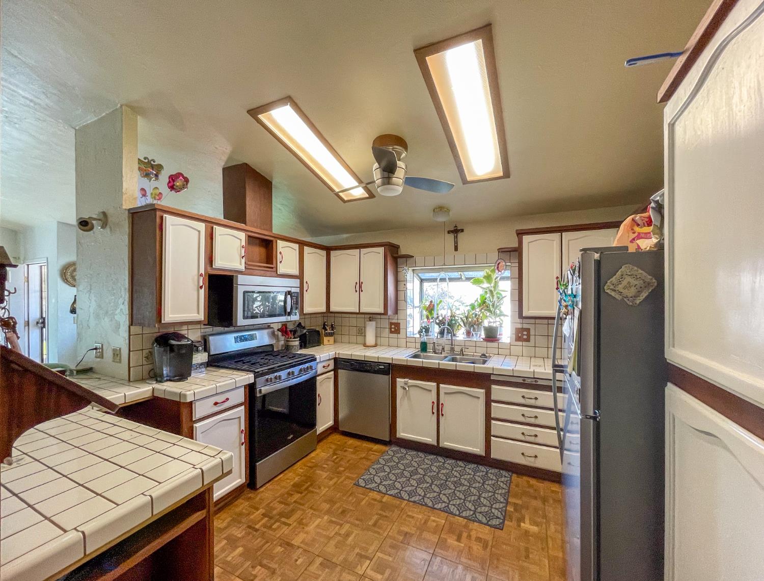 414 F Street Isleton, CA 95641 - Photo 33 of 49 a kitchen with stainless steel appliances kitchen island granite countertop a sink stove and refrigerator