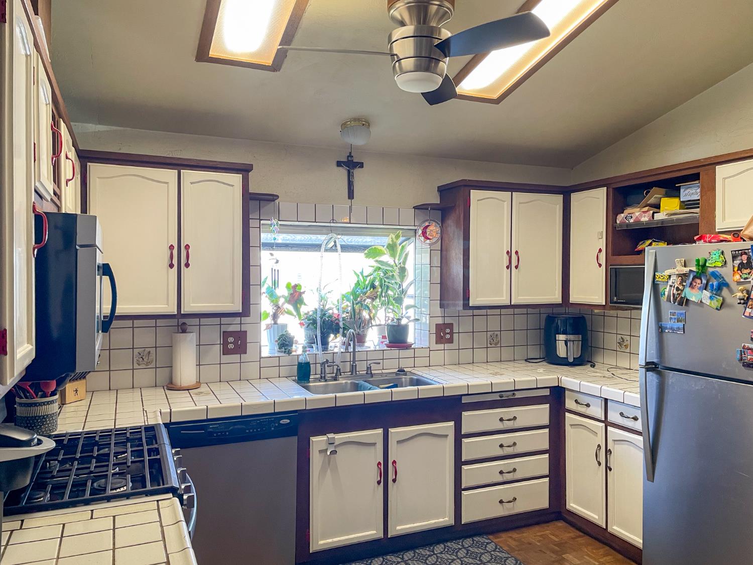 414 F Street Isleton, CA 95641 - Photo 35 of 49 a kitchen with stainless steel appliances a counter space cabinets and a window