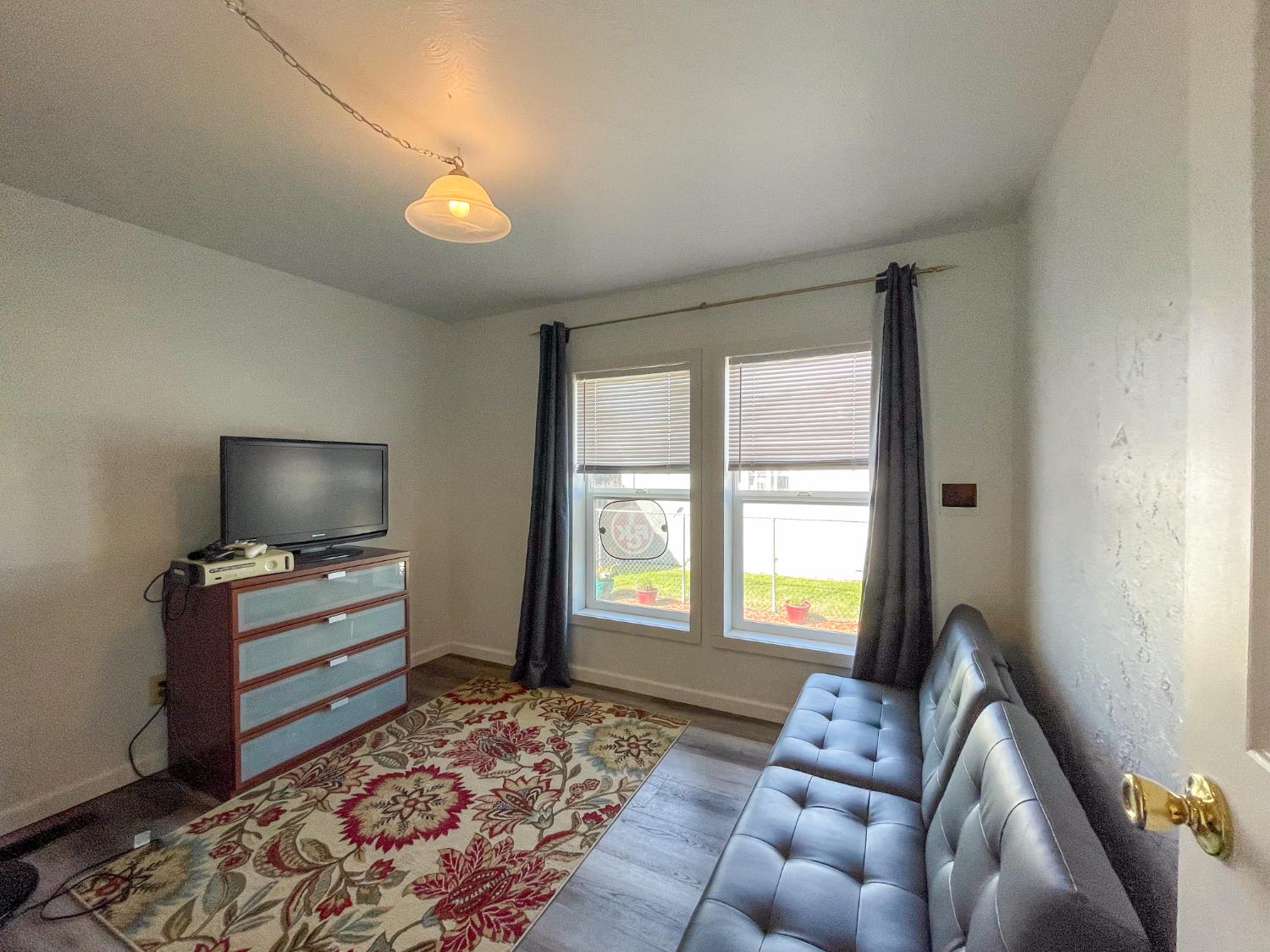 414 F Street Isleton, CA 95641 - Photo 36 of 49 a living room with furniture and a flat screen tv