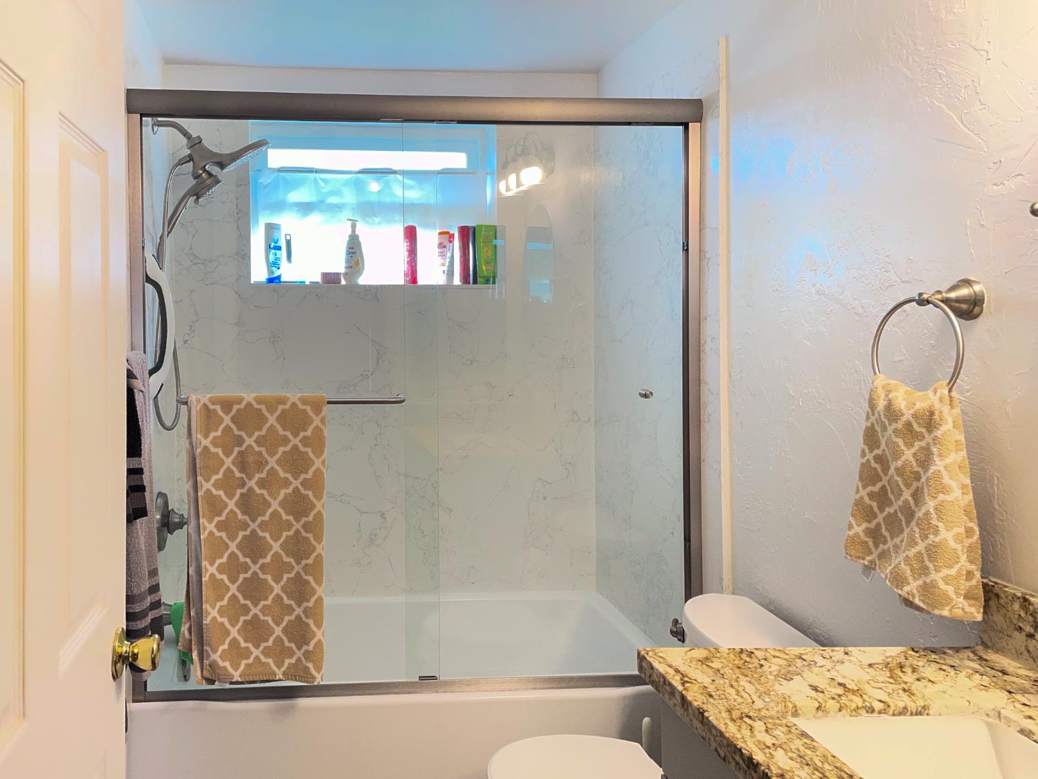 414 F Street Isleton, CA 95641 - Photo 40 of 49 a bathroom with a bathtub and shower