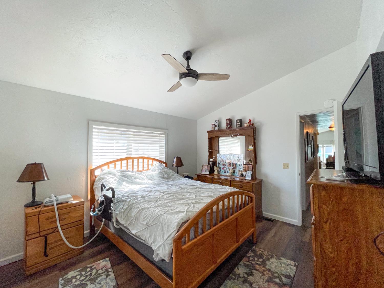 414 F Street Isleton, CA 95641 - Photo 45 of 49 a bedroom with a bed and wooden floor