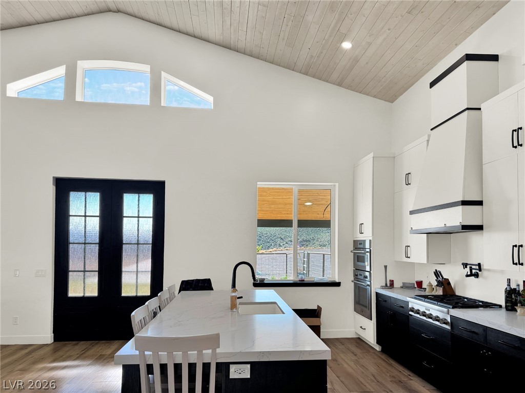 9393 North 93rd Highway Caliente, NV 89008 - Photo 27 of 41 Vast vaulted ceilings and bright windows create an open, airy atmosphere in this modern kitchen.
