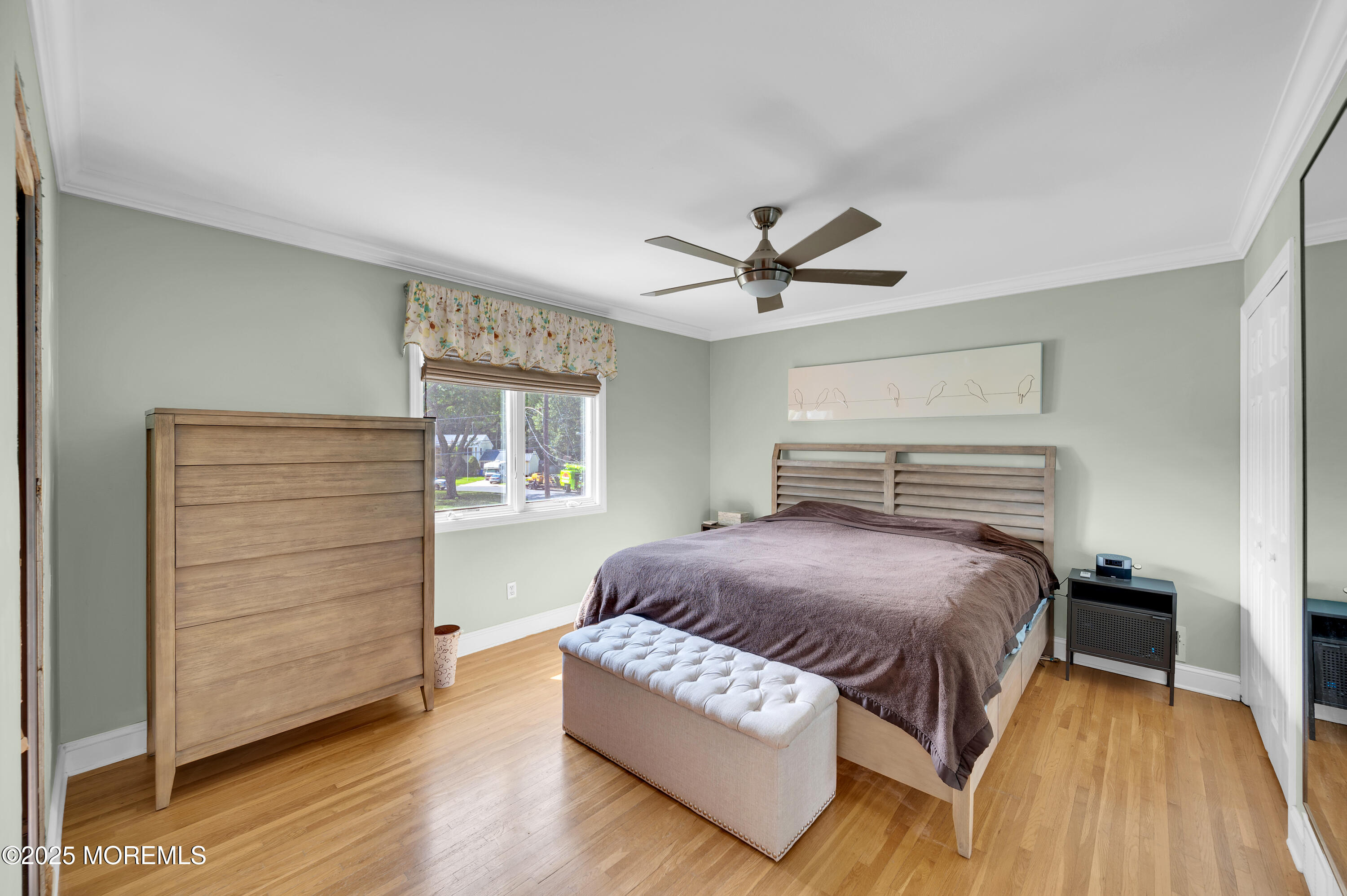 80 Robbins Court Brick, NJ 08724 - Photo 19 of 33 a spacious bedroom with a bed a dresser and a window