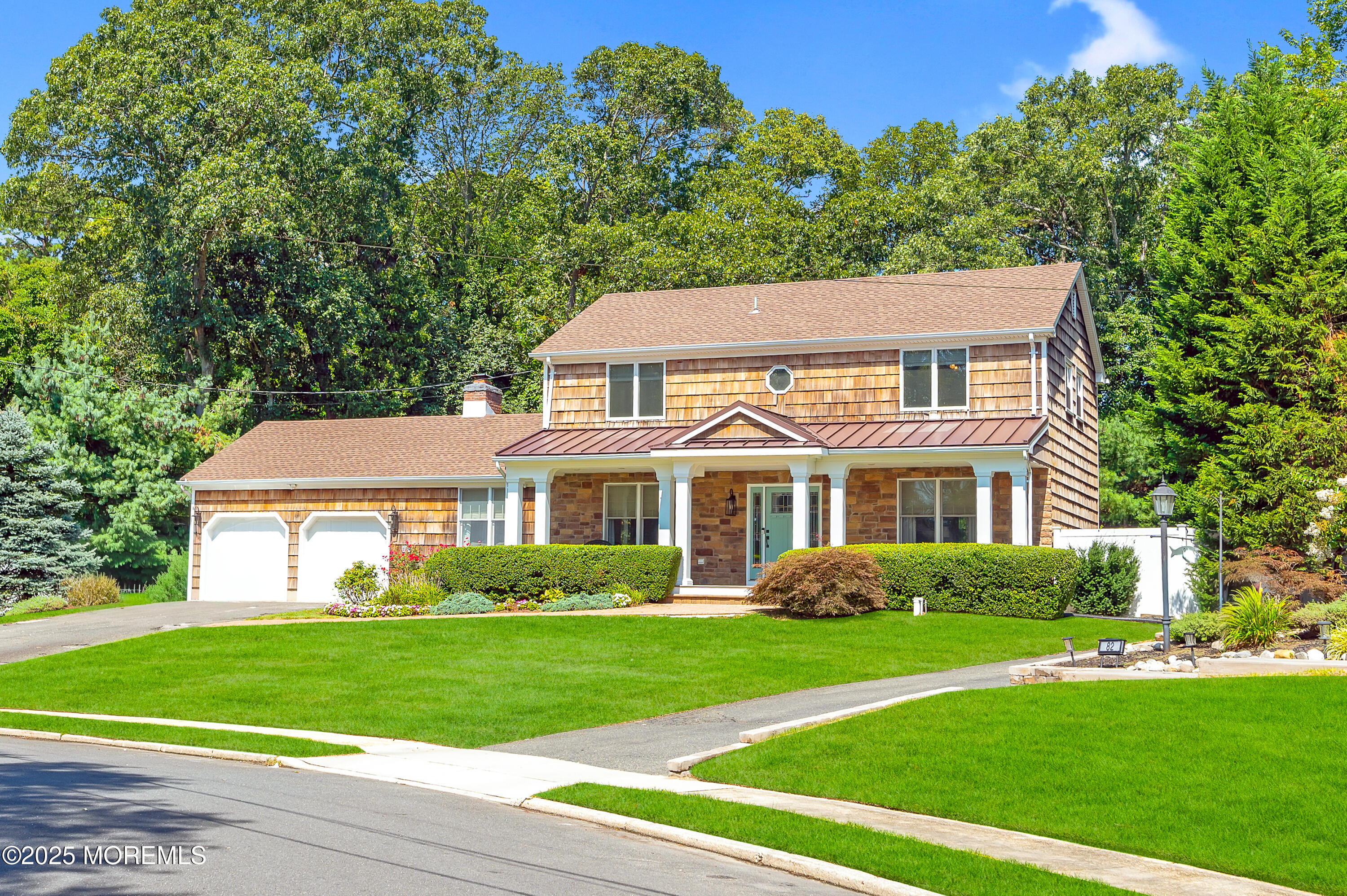 80 Robbins Court Brick, NJ 08724 - Photo 2 of 33 a front view of a house with a yard and trees