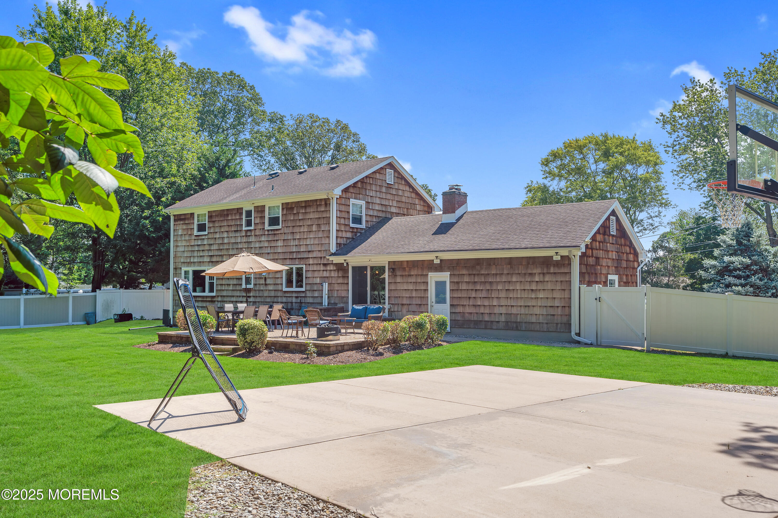 80 Robbins Court Brick, NJ 08724 - Photo 25 of 33 a house with a garden and trees