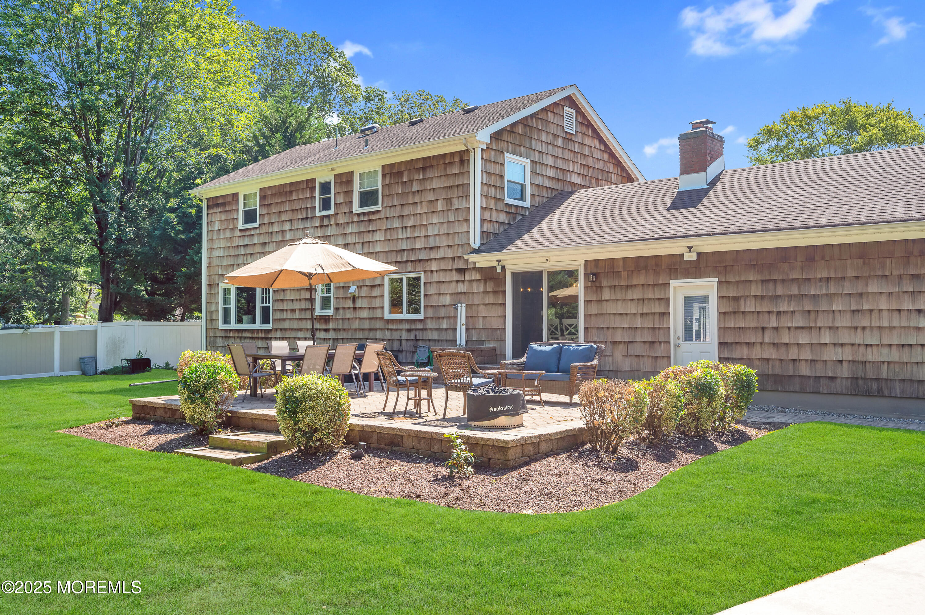80 Robbins Court Brick, NJ 08724 - Photo 26 of 33 a front view of a house with garden and patio