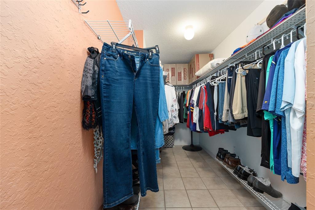 11233 Southwest 73rd Circle Ocala, FL 34476 - Photo 30 of 53 a view of walk in closet with clothes