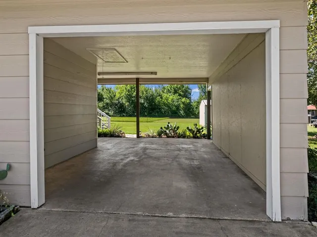 a view of a park with large trees