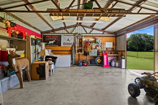 an outdoor view of house with swimming pool garden and outdoor seating