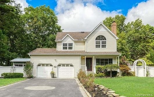 85 Mowbray Street Patchogue, NY 11772 - Photo 1 of 1 a front view of a house with a yard