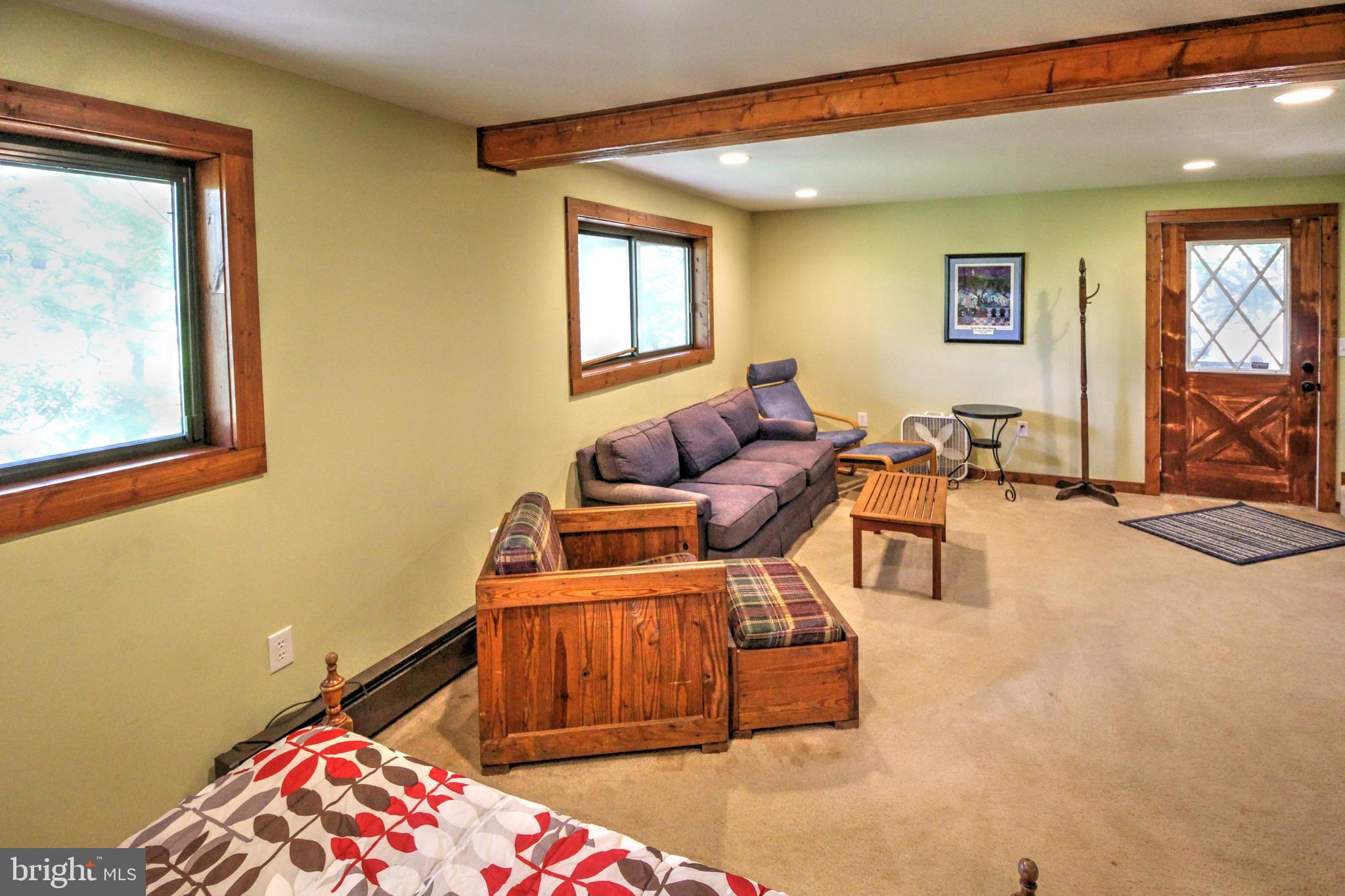 198 Hood's Point Road Basye, VA 22810 - Photo 19 of 23 a bedroom with a bed and wooden floor